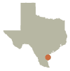 Map of Texas that shows location of Corpus Christi over background of a close-up map of the port.